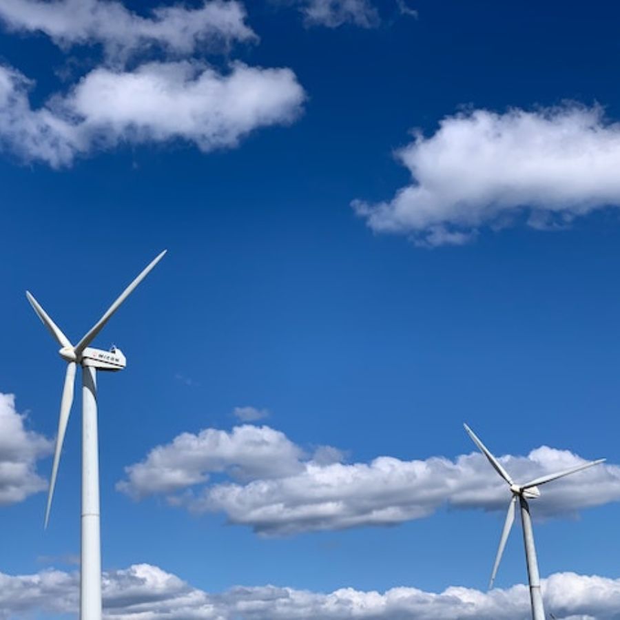 windmills on a cloudy blue sky