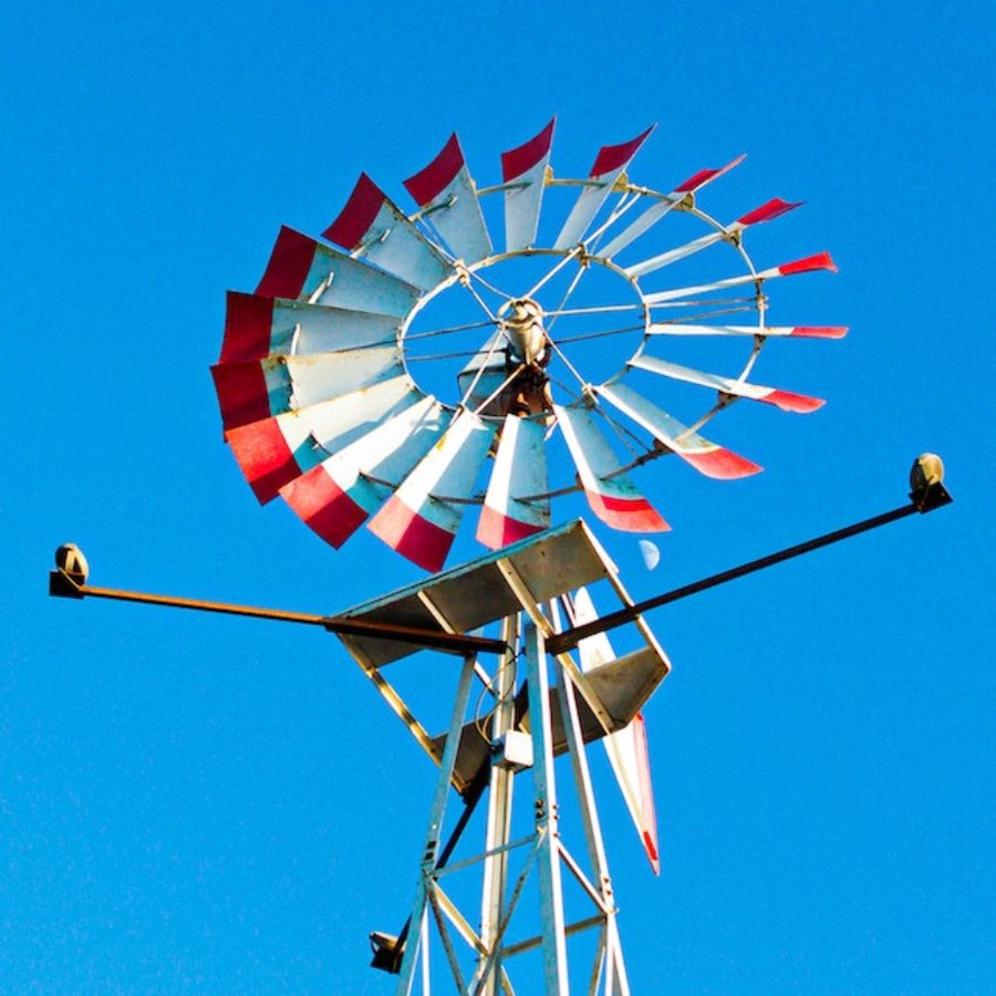 a wind mill against a blue sky